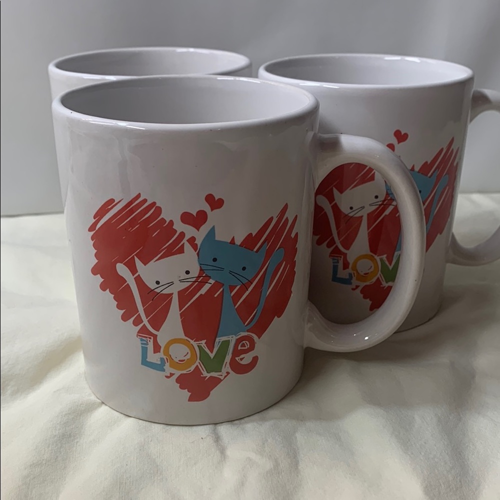 Set of three vingtage Cats in Love mugs.